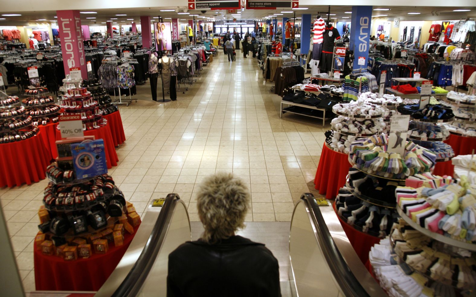 A customer goes down an escalator at a JCPenney store in Westminster, Colorado, in 2009.