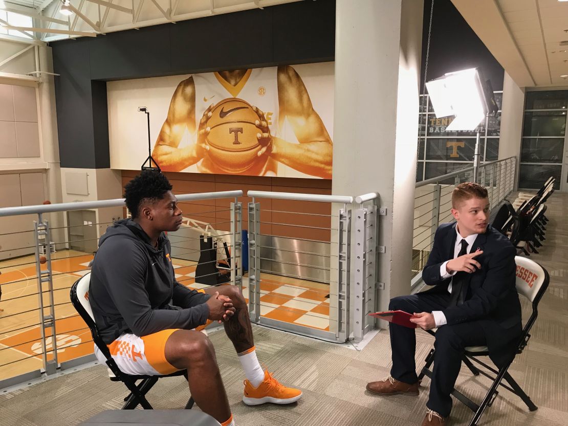 Sanning, here interviewing then-UT player Admiral Schofield, says he's known he wanted to be a sports reporter since his mid-teens.
