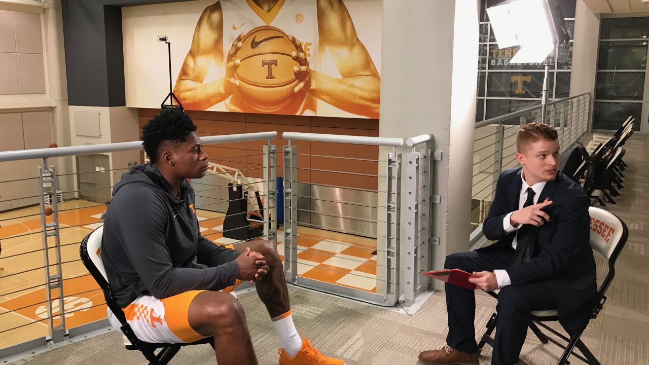 Sanning, here interviewing then-UT player Admiral Schofield, says he's known he wanted to be a sports reporter since his mid-teens.