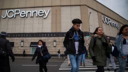 Pedestrians walk past a JC Penney Co. store at the Queens Center Mall in the Queens borough of New York, U.S., on Thursday, Feb. 25, 2016. JC Penney Co. is scheduled to release earnings figures on February 26. Photographer: Michael Nagle/Bloomberg via Getty Images