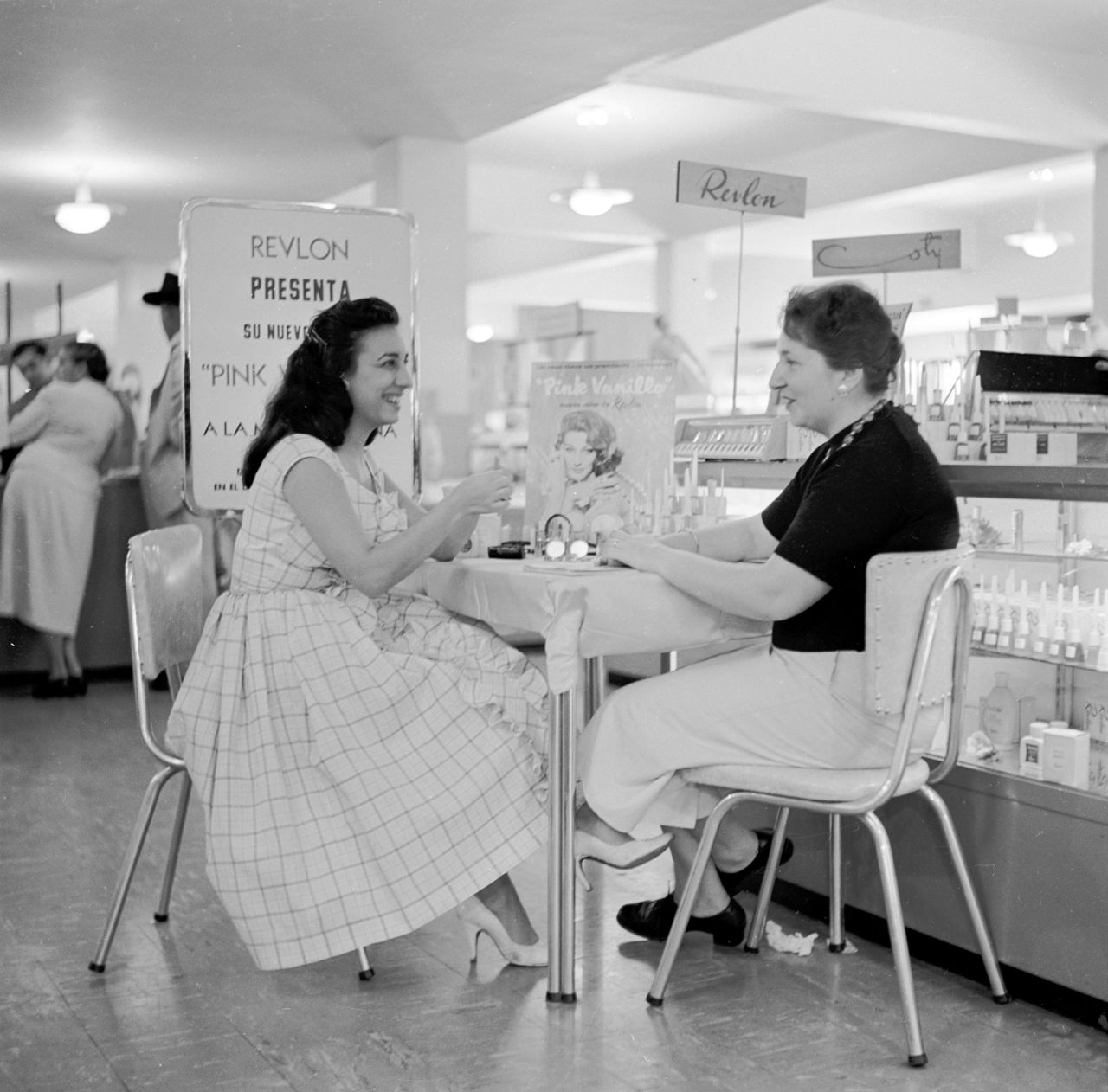 A woman receives a cosmetics consultation at a Sears store in Caracas, Venezuela, circa 1953.