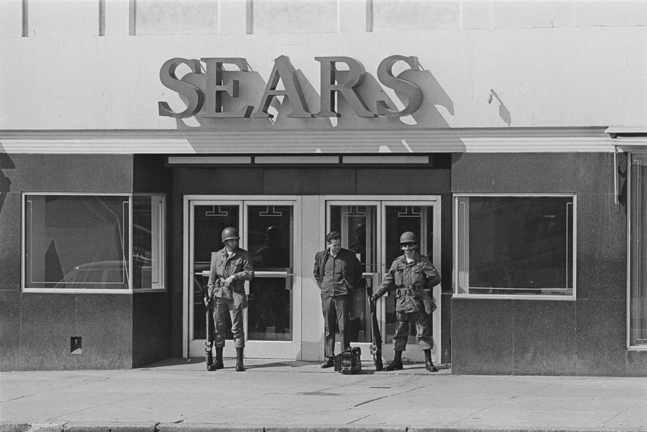 Soldiers guard a Sears store in Baltimore after riots broke out following the assassination of Martin Luther King Jr. in 1968.