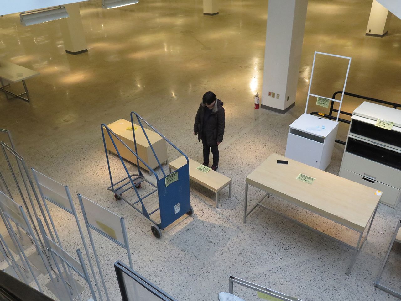 A woman in Mississauga, Ontario, looks at used store furniture for sale in 2018. The Sears location was closing forever.
