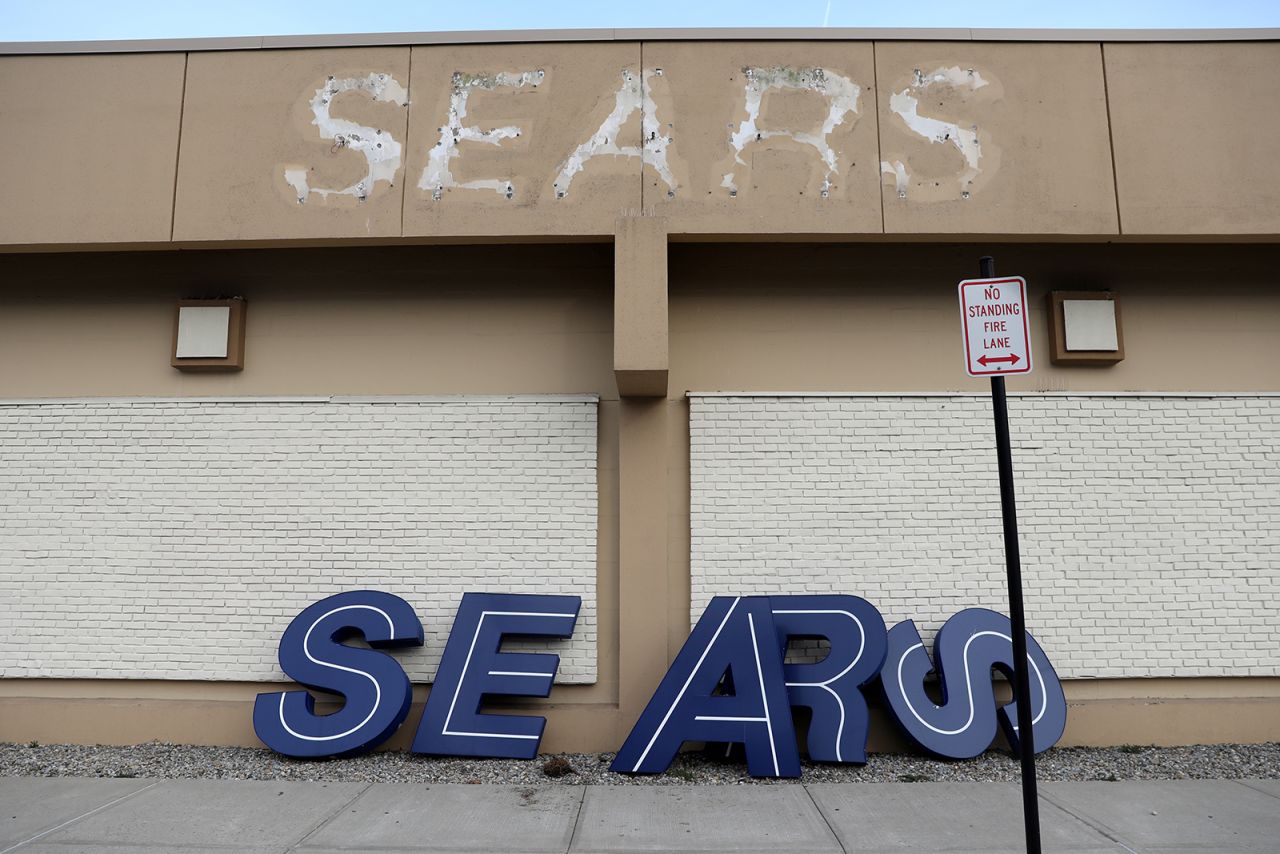 A dismantled sign leans outside a Sears store in Nanuet, New York, one day after it closed in 2019.