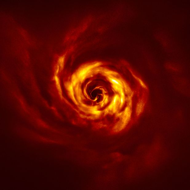 A bright yellow "twist" near the center of this image shows where a planet may be forming around the AB Aurigae star. The image was captured by the European Southern Observatory's Very Large Telescope.