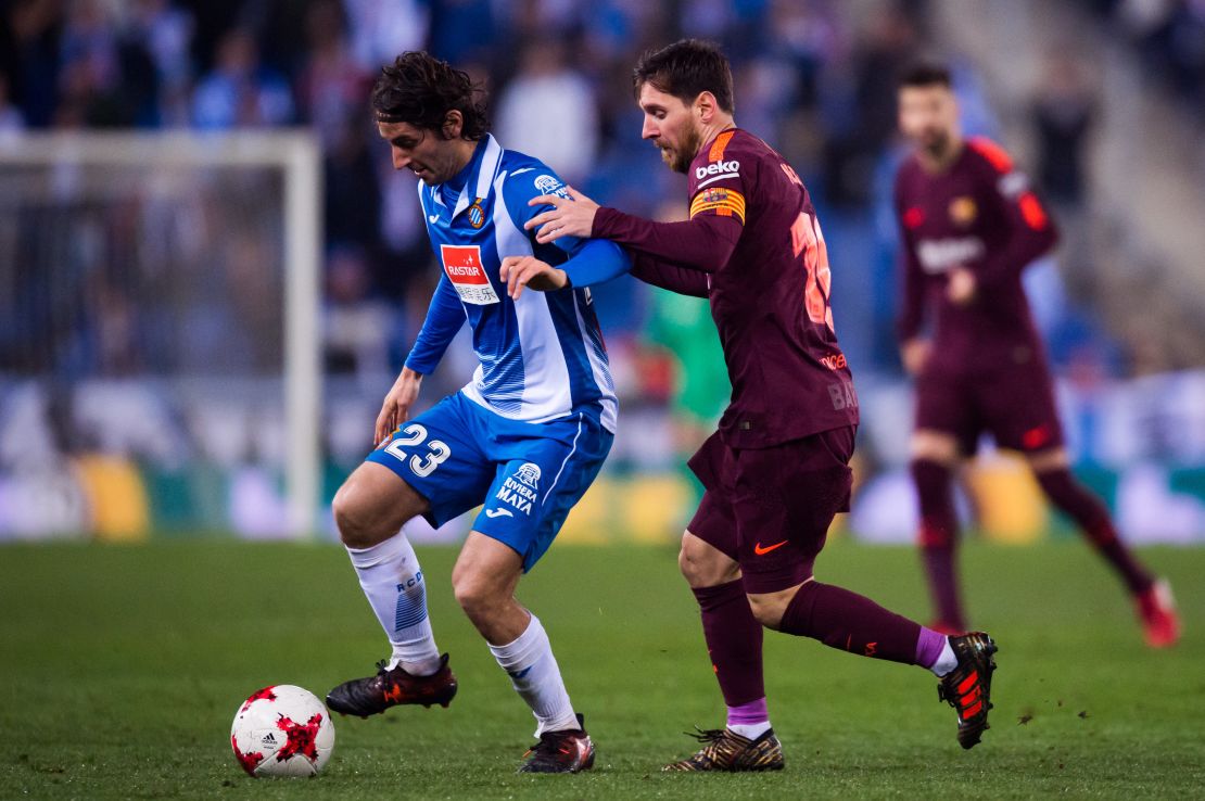 Lionel Messi tries to tackle Granero during Barcelona's La Liga clash against Espanyol in 2018.