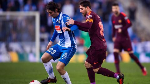 Lionel Messi tries to tackle Granero during Barcelona's La Liga clash against Espanyol in 2018.