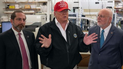 President Donald Trump speaks next to US Health and Human Service Secretary Alex Azar and CDC Director Robert Redfield  during a tour of the Centers for Disease Control and Prevention on March 6, 2020. 