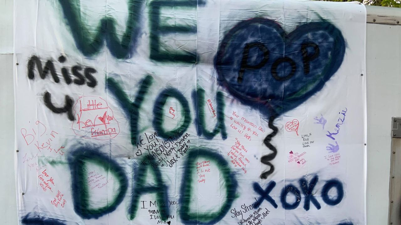 Kevin Johnson came up with the idea to spray paint a sheet with messages for his father.