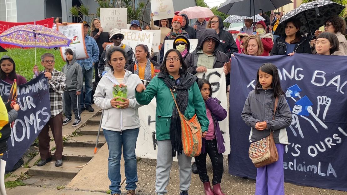 Martha Escudero and her daughters at a Reclaiming Our Homes rally.