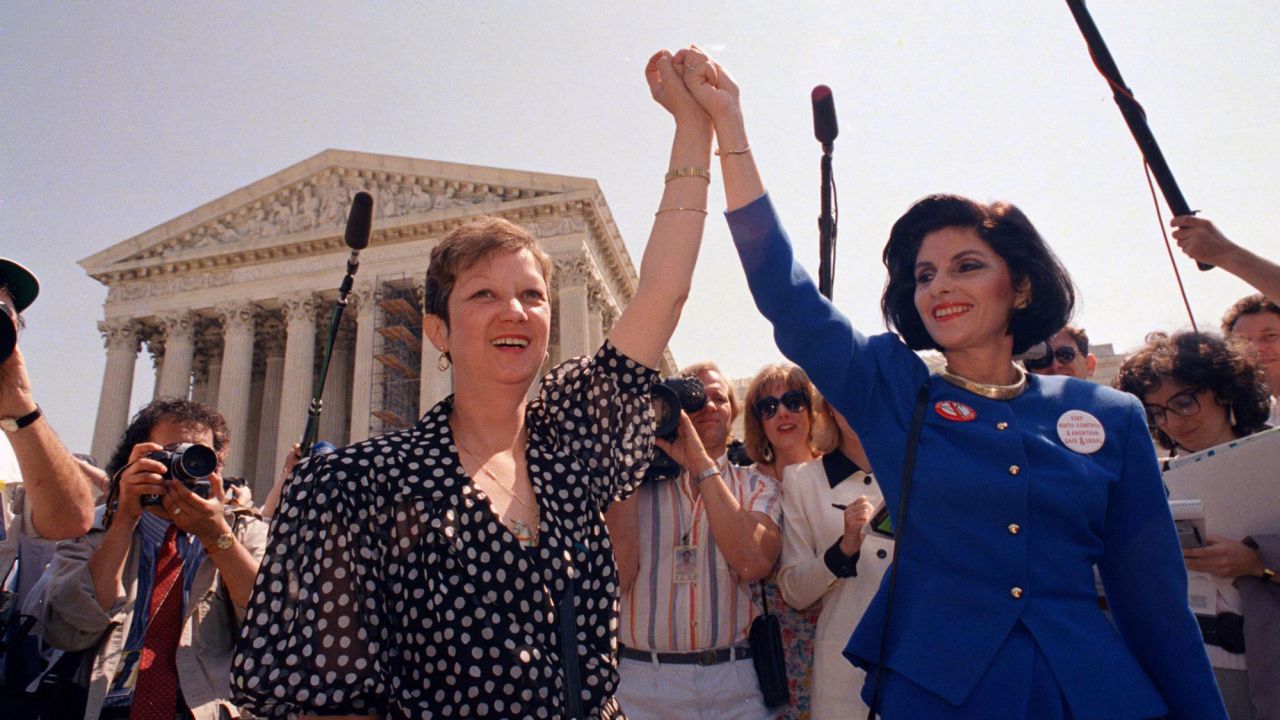 Norma McCorvey (left) and her attorney Gloria Allred stand near the Supreme Court in 1989.