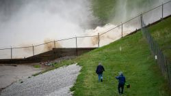 This photo shows a view of a dam on Wixom Lake in Edenville, Mich., Tuesday, May 19, 2020. People living along two mid-Michigan lakes and parts of a river have been evacuated following several days of heavy rain that produced flooding and put pressure on dams in the area. (Kaytie Boomer/The Bay City Times via AP)