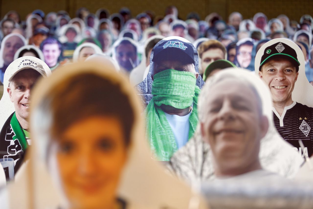 Cardboard cutouts of <a href="https://www.bundesliga.com/en/bundesliga/news/borussia-monchengladbach-fans-pay-for-cardboard-cut-outs-charity-coronavirus-10911" target="_blank" target="_blank">Borussia Mönchengladbach soccer fans</a> are seen at the Borussia-Park stadium in Mönchengladbach, Germany, on May 19. The Bundesliga, Germany's top pro soccer league, <a href="https://www.cnn.com/2020/05/16/sport/germany-bundesliga-return-football-spt-intl/index.html" target="_blank">became the first major European competition to return during the coronavirus pandemic.</a> But fans were not allowed to attend.