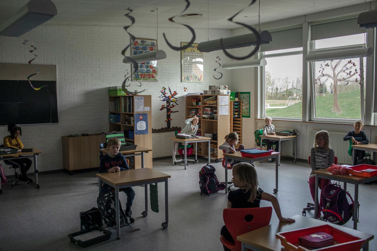 Elementary school students sit at desks spaced apart in Løgumkloster, Denmark, on April 16. <a href="http://www.cnn.com/2020/05/04/world/gallery/education-coronavirus-wellness/index.html" target="_blank">Related photos: How the pandemic has changed education</a>