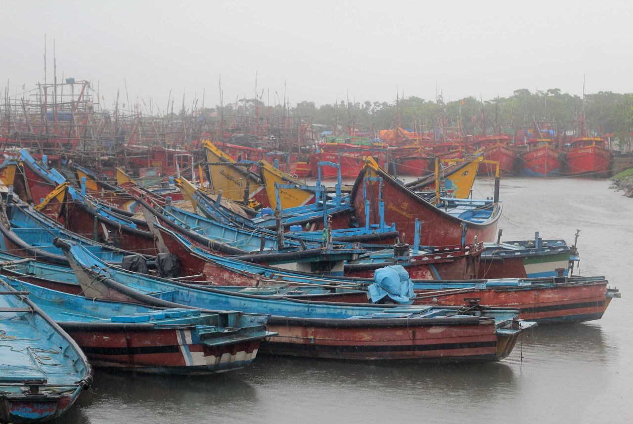 Boats are anchored at a fishing harbor in Paradeep.