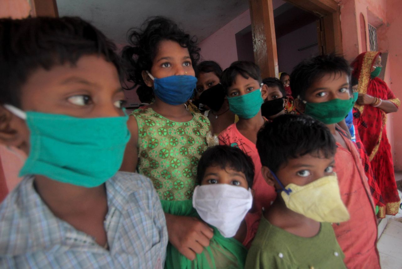 Children wear face masks at a relief camp in Paradeep, India.