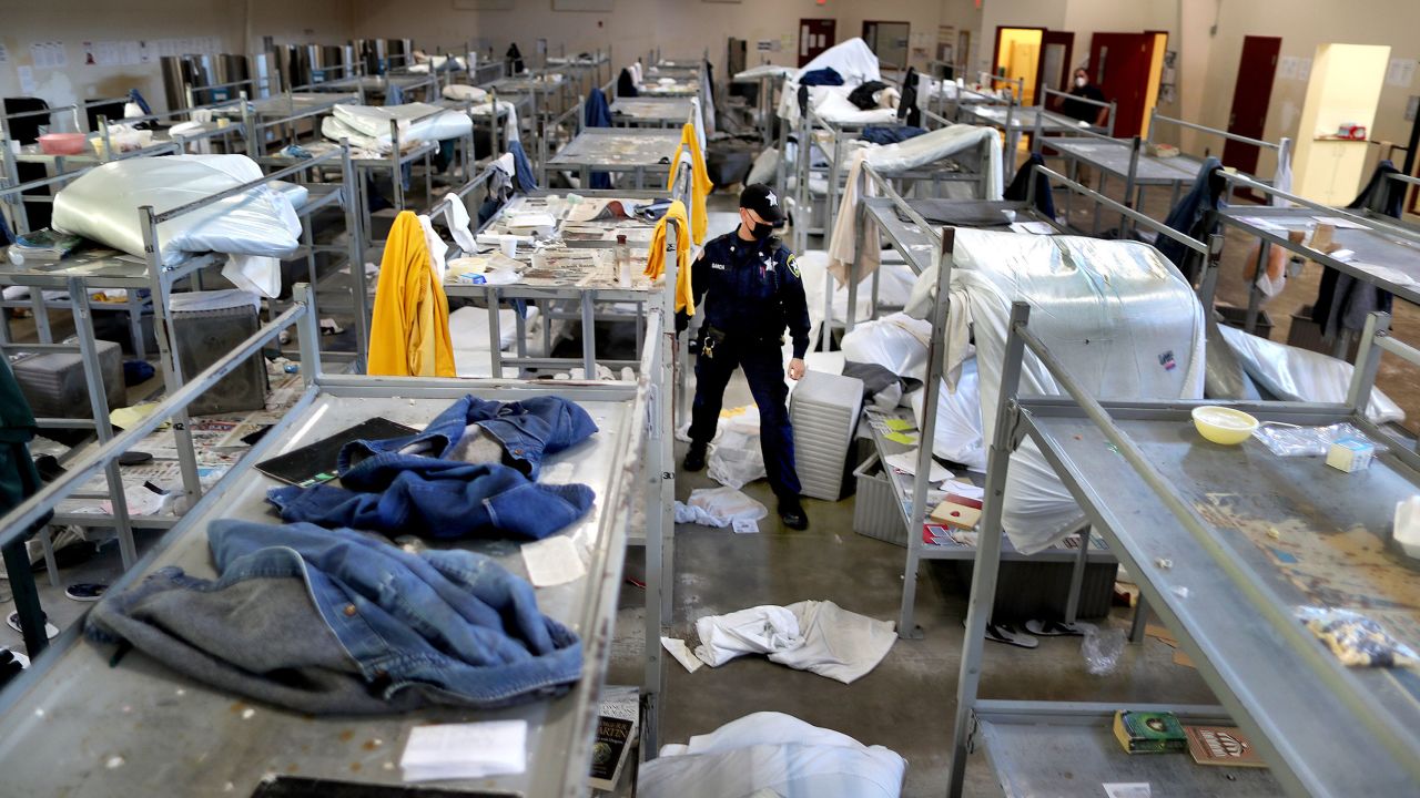 A corrections officer examines a unit in disarray at an ICE detention center in Bristol County, Massachusetts, on May 2, 2020. 