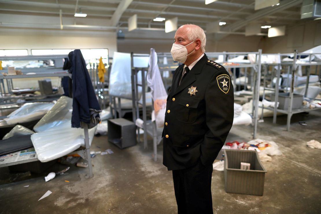 Bristol County Sheriff Thomas Hodgson stands inside the sleeping area around rows of bunk beds in disarray at the C. Carlos Carreiro Immigration Detention Center on May 2, 2020. 