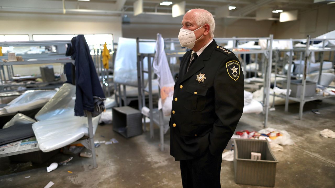 Bristol County Sheriff Thomas Hodgson stands inside the sleeping area around rows of bunk beds in disarray at the C. Carlos Carreiro Immigration Detention Center on May 2, 2020. 