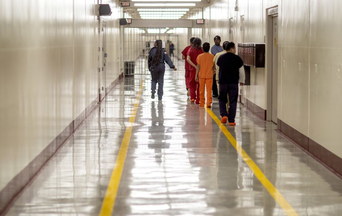 Detainees walk through the halls at the Stewart Detention Center, in Lumpkin, Georgia, on November 15, 2019.
