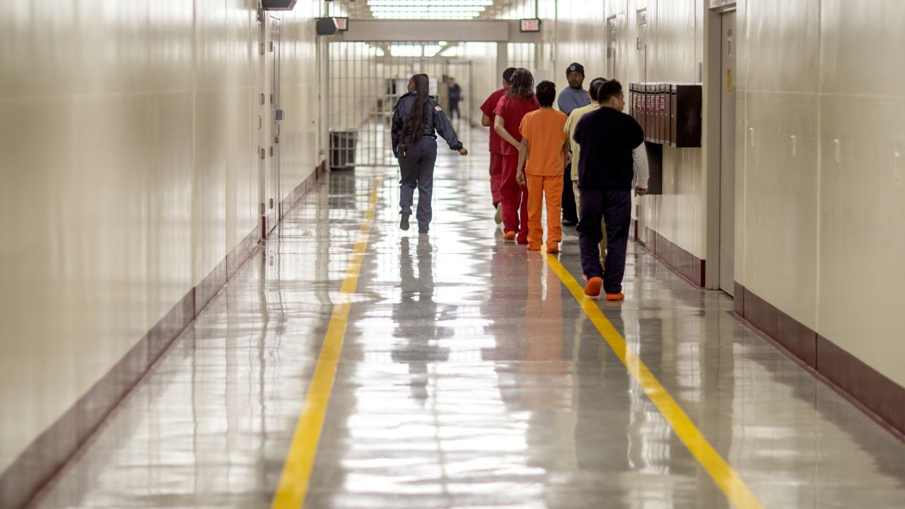 Detainees walk through the halls at the Stewart Detention Center, in Lumpkin, Georgia, on November 15, 2019. 