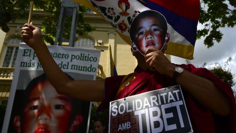 Pro-Tibetan protestors hold picures of Gendun Cheokyi Nyima (recognized by the Dalai Lama as the 11th Panchen Lama) during a demonstration outside the Chinese consulate in Barcelona on May 17, 2013.