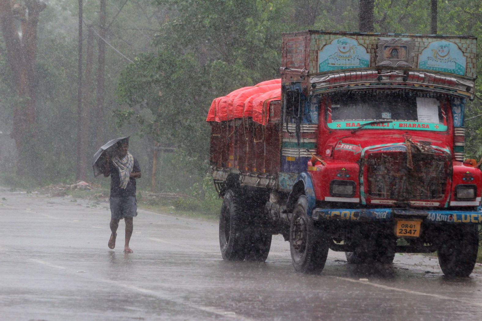 A man walks along a road in India's Bhadrak district.