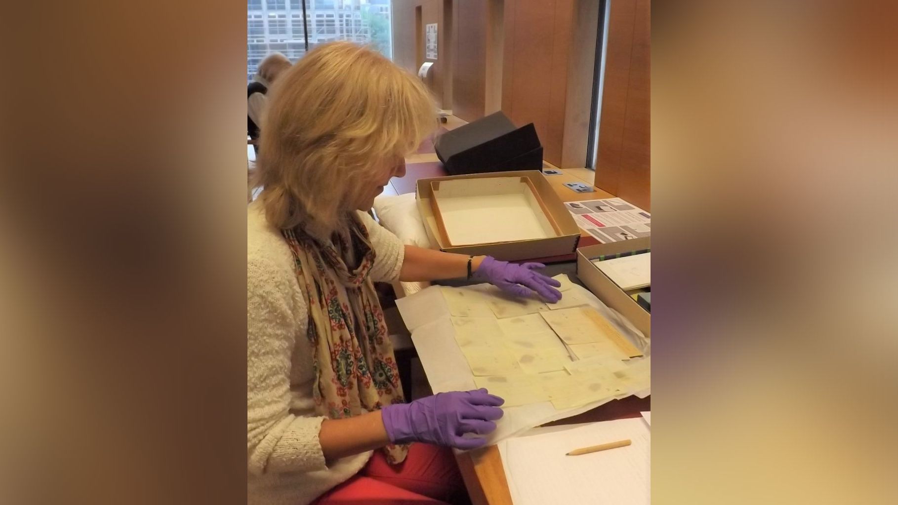 Professor Joan Taylor examining the Dead Sea Scrolls fragments. 