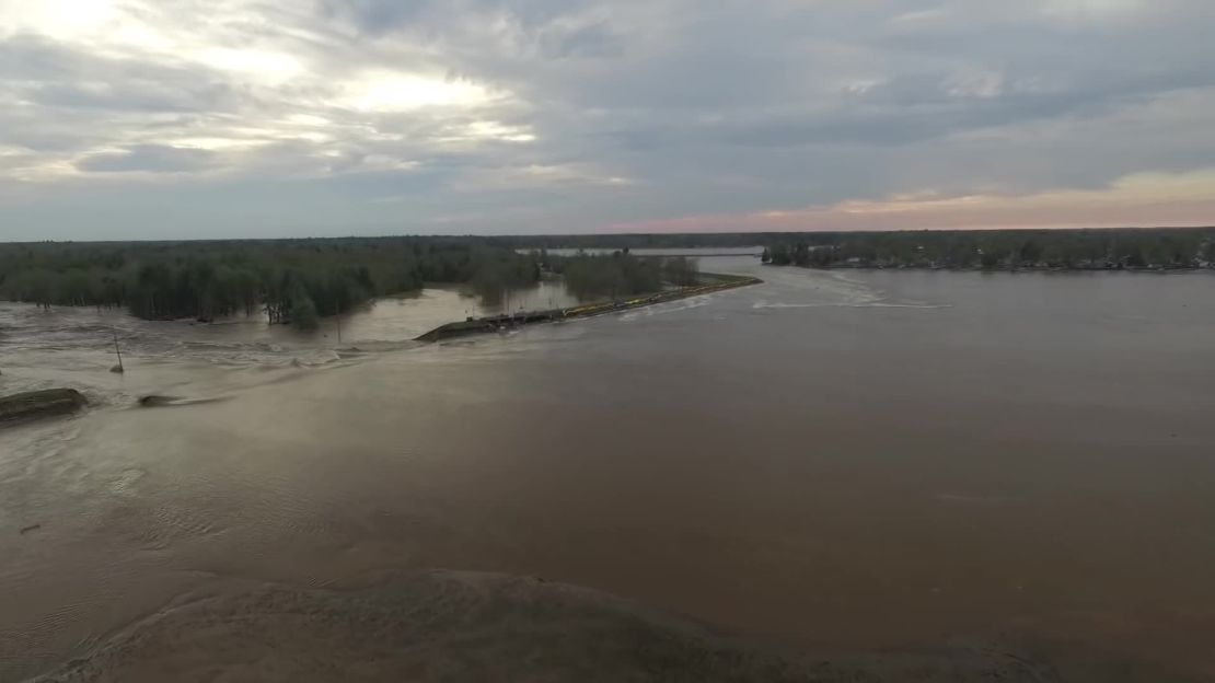 The Tittabawassee River breaches the Edenville Dam on Tuesday.