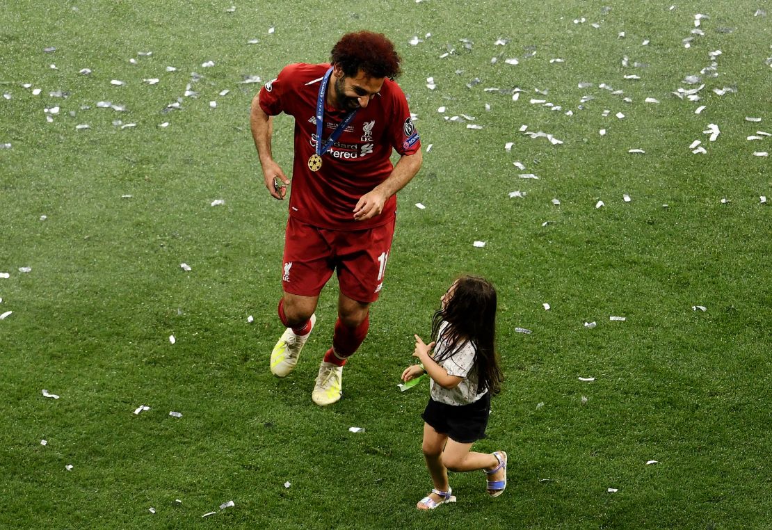Salah celebrates with his daughter Makka after his side won during the UEFA Champions League Final.
