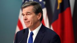 North Carolina Gov. Roy Cooper listens to a question during a briefing on the coronavirus pandemic at the Emergency Operations Center in Raleigh, N.C., Wednesday, May 20, 2020. (Ethan Hyman/The News & Observer via AP)