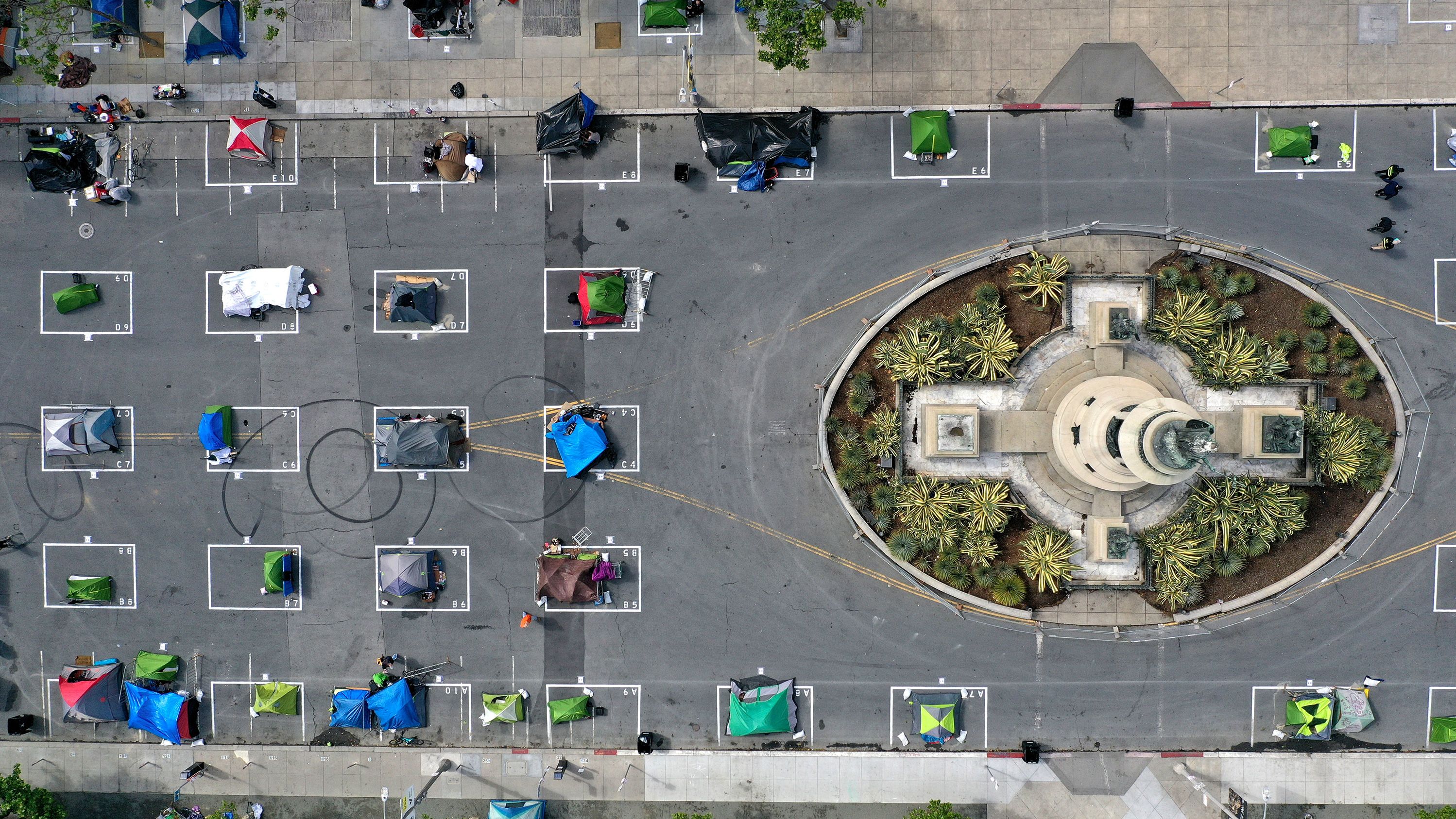 An aerial view of San Francisco's first temporary sanctioned tent encampment for the homeless on May 18, 2020 in San Francisco, California. The camp provides a sleeping area in a fenced-off space near City Hall with marked spots for tents that practice social distancing.