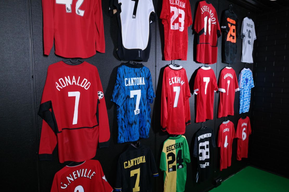 Famous number seven jerseys hang on a wall in the museum.