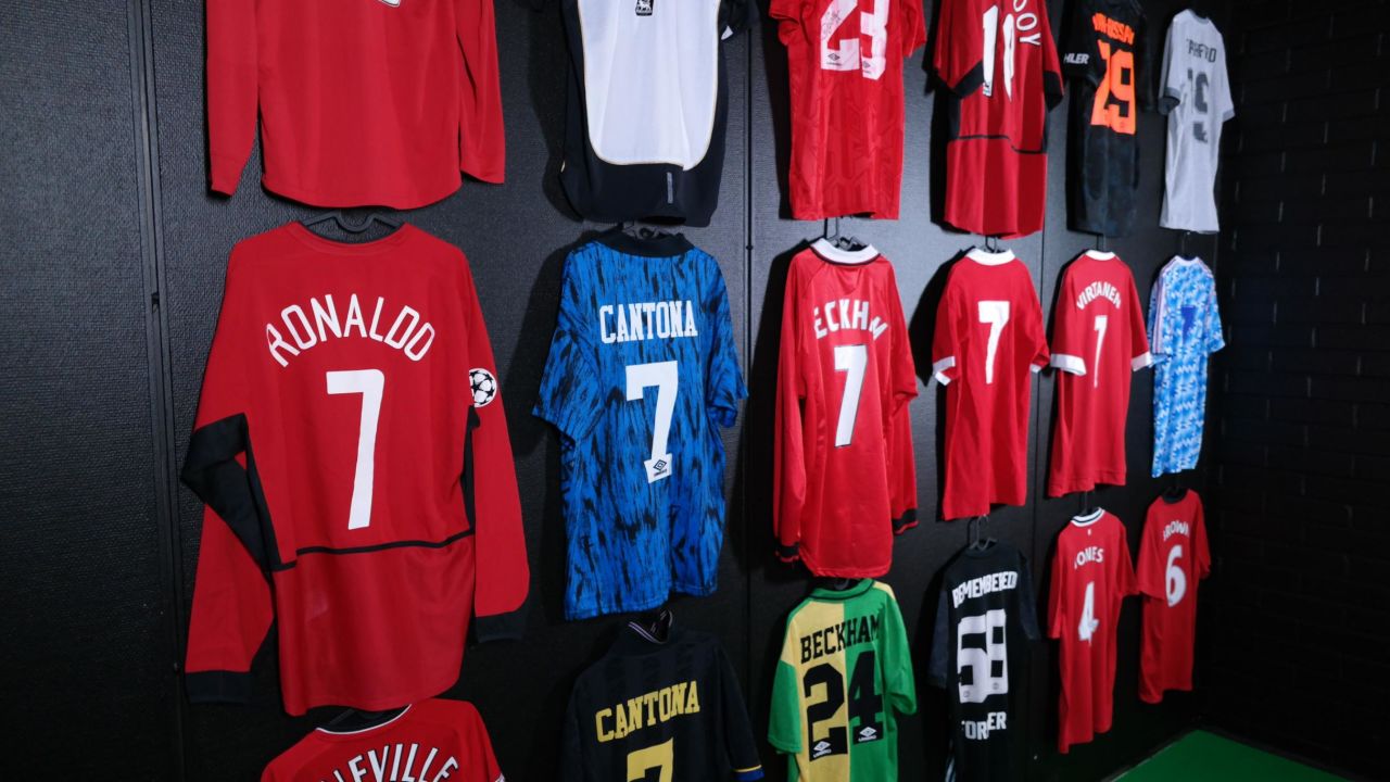 Famous number seven jerseys hang on a wall in the museum.