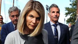 Lori Loughlin and her husband Mossimo Giannulli, right, leave the John Joseph Moakley United States Courthouse in Boston on Aug. 27, 2019.