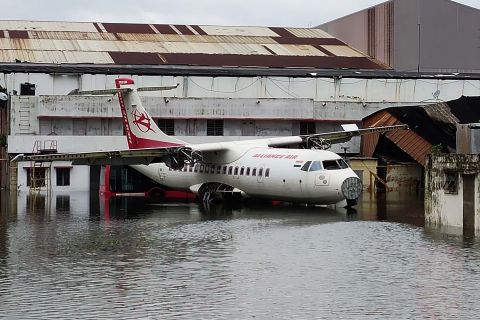 An aircraft is parked at the flooded Netaji Subhas Chandra Bose International Airport in Kolkata.