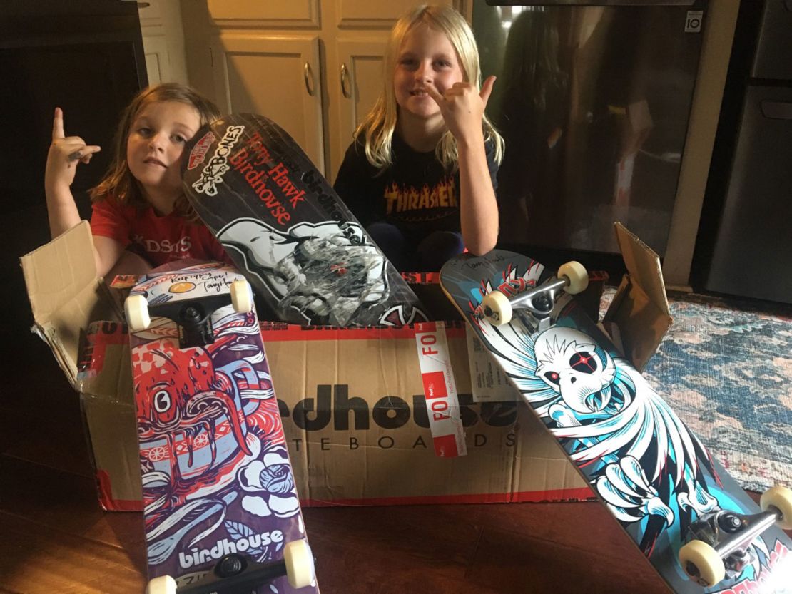 Cooper Morgan (left) and Tucker Morgan (right) with the package sent to them by pro skater Tony Hawk.
