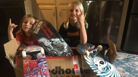 Cooper Morgan (left) and Tucker Morgan (right) with the package sent to them by pro skater Tony Hawk.