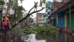 A man cuts branches of an uprooted tree after Cyclone Amphan made its landfall, in Kolkata, India, May 21, 2020. REUTERS/Rupak De Chowdhuri     TPX IMAGES OF THE DAY