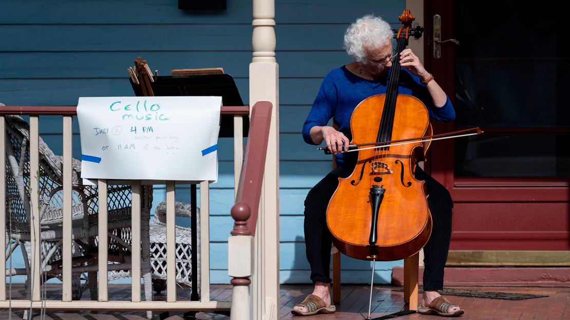 Cellist Jodi Beder plays on her front porch in Mount Rainier, Maryland. You can learn an instrument, too.