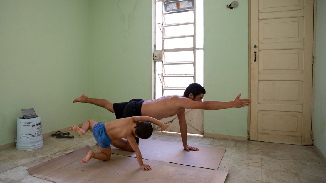 Photographer Bénédicte Desrus and his son Thiago  do yoga together during the pandemic in Mérida, Yucatán, Mexico.