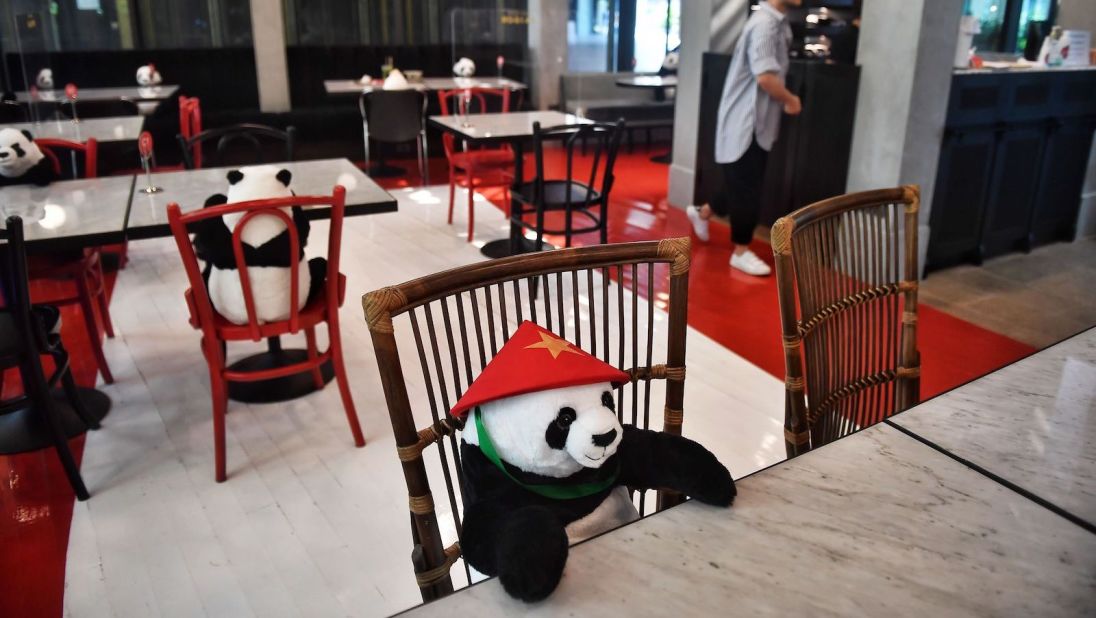 <strong>Dinner companions: </strong>Stuffed toy pandas are used to enforce Thailand's social distancing rules at the Maison Saigon restaurant in Bangkok on May 13, 2020.  