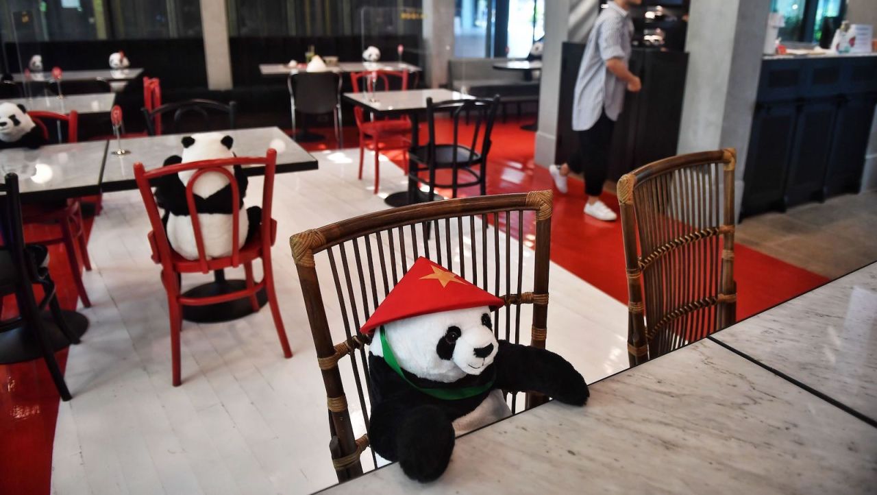 <strong>Dinner companions: </strong>Stuffed toy pandas are used to enforce Thailand's social distancing rules at the Maison Saigon restaurant in Bangkok on May 13, 2020.  