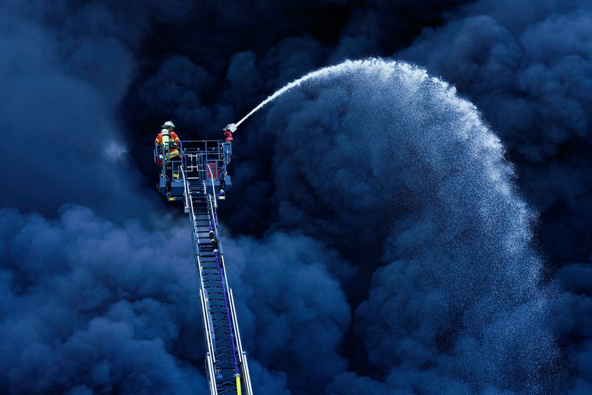 Firefighters battle a blaze at a plastics factory in Ladenburg, Germany, on Tuesday, May 19.