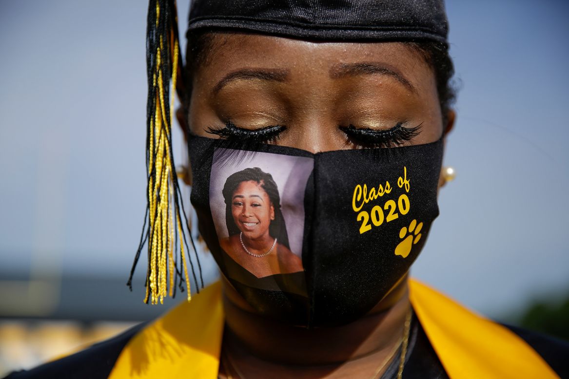 High school senior Yasmine Protho wears a photo of herself on her protective mask as she graduates in Cusseta, Georgia, on Friday, May 15. Graduates were recognized in small groups, with limited guests attending. <a href="https://www.cnn.com/2020/05/04/world/gallery/education-coronavirus-wellness/index.html" target="_blank">In pictures: How the pandemic has changed education</a>