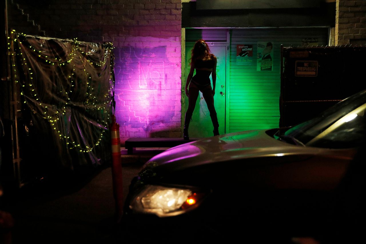Kady Heard performs a burlesque routine during a drive-thru performance at the Majestic Repertory Theatre in Las Vegas on Saturday, May 16. The theater held interactive performances for people in their cars. <a href="https://www.cnn.com/2020/05/07/world/gallery/drive-thrus-drive-ins-coronavirus/index.html" target="_blank">Drive-thrus and drive-ins: How we're relying on our cars during the pandemic</a>