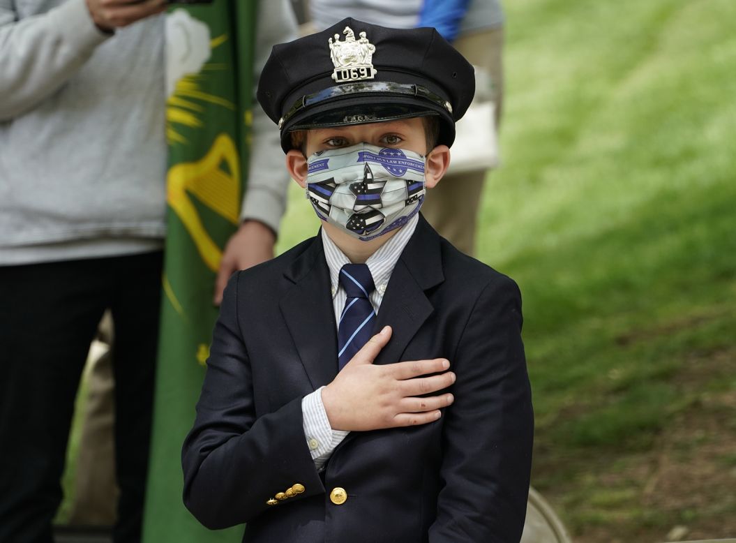 Gavin Roberts, 10, attends the funeral service of his father, Charles, in Glen Ridge, New Jersey, on Thursday, May 14. Charles Roberts was a Glen Ridge police officer who died from coronavirus.