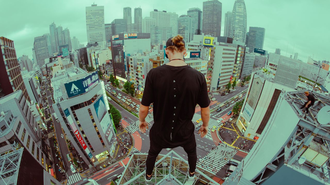 A member of Storror looks down at the streets below.
