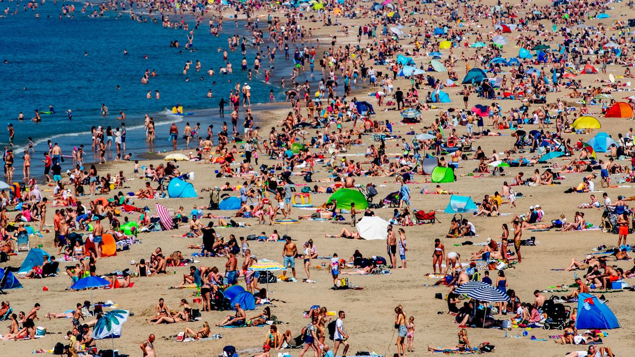 Warnings over social distancing didn't keep sun seekers away from this Netherlands beach on Thursday.