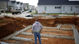 A contractor surveys freshly-poured concrete while working on a home under construction in the Norton Commons subdivision in Louisville, Kentucky, U.S., on Monday, March 23, 2020. Purchases of new U.S. homes in February held close to an almost 13-year high, showing momentum in the residential real estate market before economic activity fell victim to the coronavirus. Photographer: Luke Sharrett/Bloomberg via Getty Images